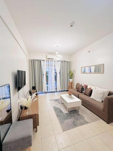 TV a/nebo společenská místnost v ubytování Magallanes Residences Condominium 211&212B
