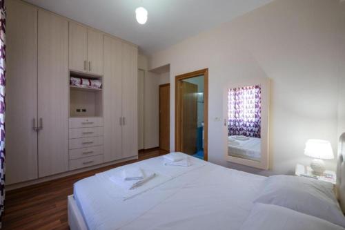 Postel nebo postele na pokoji v ubytování Taho Apartments