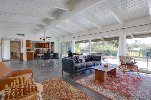 a living room with a couch and a table at Borrego Springs Retreat with Pool and Mtn Views in Borrego Springs