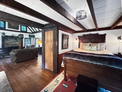 a bedroom with a bed and a living room at JME Retreat in Colwell