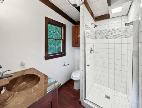 a bathroom with a sink and a shower at JME Retreat in Colwell