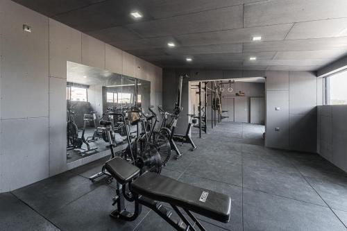 a gym with a bunch of bikes in a room at Sevenfarm Turismo Rural in Mangualde