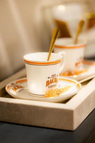 a table with two cups of coffee on a tray at Villa Stevana in Oulad Mazoug