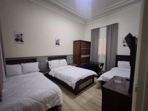 Katil atau katil-katil dalam bilik di Boutique Centro Citta Hotel