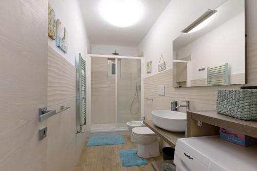 a bathroom with a sink and a toilet and a shower at Gli Ulivi in Bogliasco