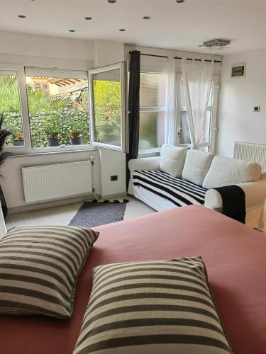 a living room with a bed and a couch at Studio Koper in Koper