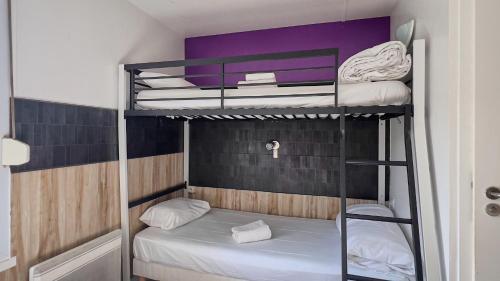 two bunk beds in a small room at Fasthotel La Roche-sur-Yon in Mouilleron-le-Captif