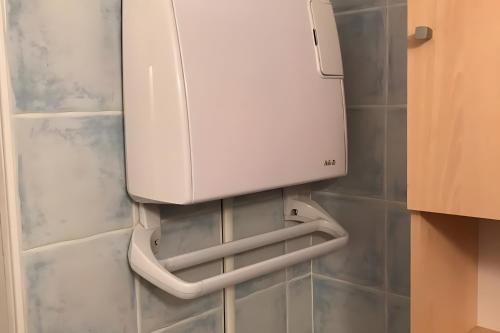 a washer and dryer on the wall of a bathroom at Appartamento In Chalet in Domène