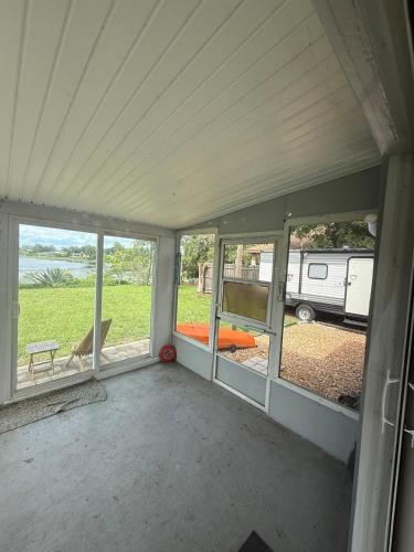 a garage with windows and a view of a rv at Lake Front Entire Home FL Getaway in Deltona