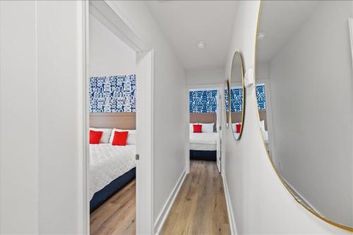 a room with a mirror and a bed in it at Pet Friendly Condo across from the beach in Myrtle Beach