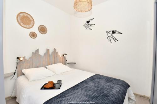 Ένα ή περισσότερα κρεβάτια σε δωμάτιο στο appartement proche plage royan