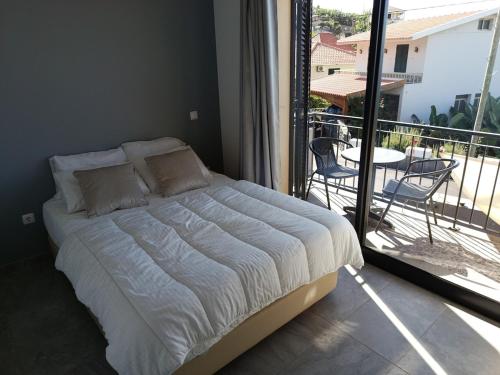 Postel nebo postele na pokoji v ubytování A Casa do Encanto da Ana & Luis