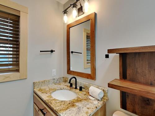 a bathroom with a sink and a mirror at Hearthstone in McHenry