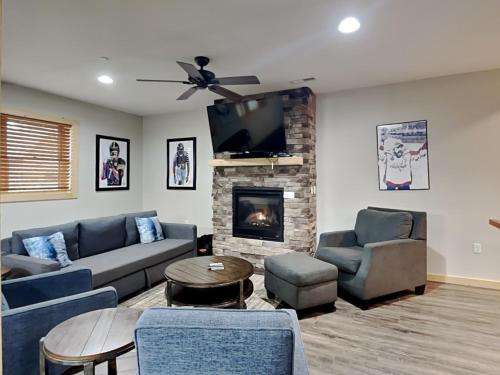 a living room with a couch and a fireplace at Hearthstone in McHenry