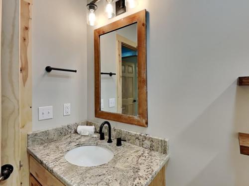 a bathroom with a sink and a mirror at Hearthstone in McHenry
