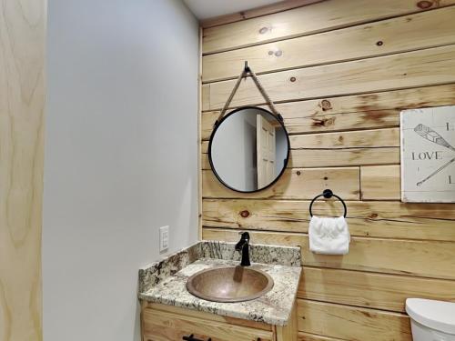 a bathroom with a sink and a mirror at Hearthstone in McHenry