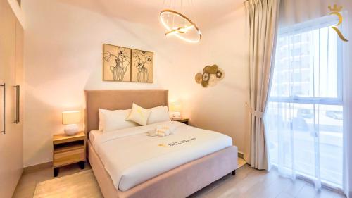 a bedroom with a bed and a window at 1BR Cozy Yas Island with 10 Min to Grand Prix in Abu Dhabi