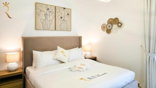 Ένα ή περισσότερα κρεβάτια σε δωμάτιο στο Zenith 1BR Retreat in Yas Island