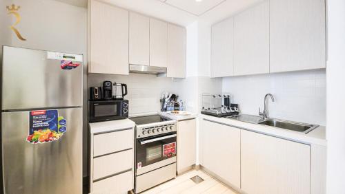 Η κουζίνα ή μικρή κουζίνα στο Zenith 1BR Retreat in Yas Island