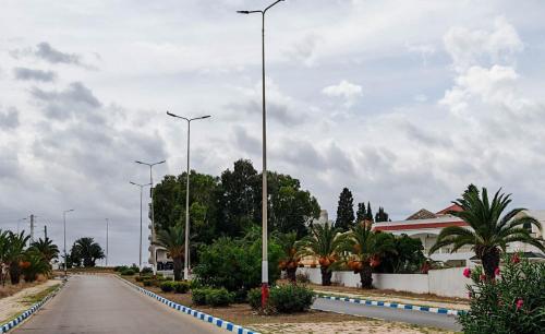 a street with street lights on the side of a road at Appartement a Kantaoui in Port El Kantaoui