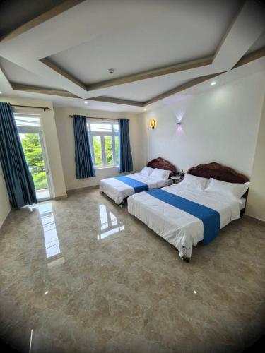 Katil atau katil-katil dalam bilik di JOY Hotel