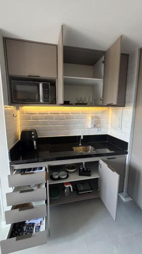 Η κουζίνα ή μικρή κουζίνα στο Studio a 600m do Park Sul e Unimed