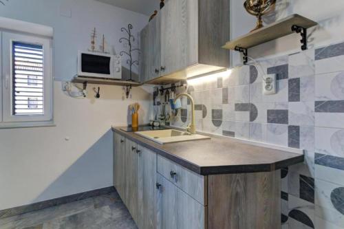 Η κουζίνα ή μικρή κουζίνα στο City Apartments & Studio App Frankopan
