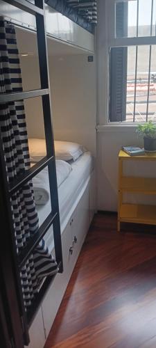 a small room with a bunk bed and a window at HBB Hostel Brasil Bar- Vila Madalena - São Paulo-SP - Próximo a Beco do Batman, Paulista, Allianz Parque, Morumbi, Acesso 24hs in São Paulo