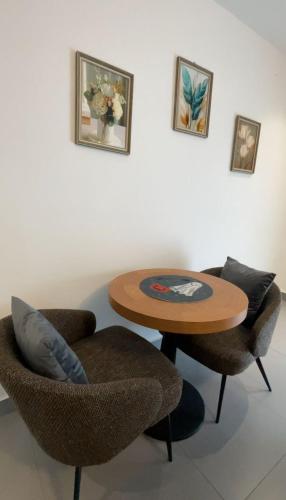 a table and two chairs in a room at 1bed with pool and restaurant apartment in Accra