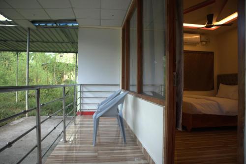 Postel nebo postele na pokoji v ubytování Raindrop Homestay Havelock
