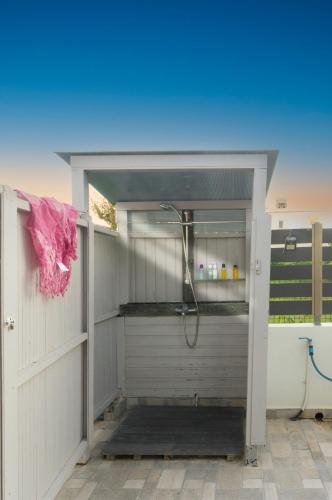a bathroom with a shower inside of a building at Drosoula House in Agios Georgios