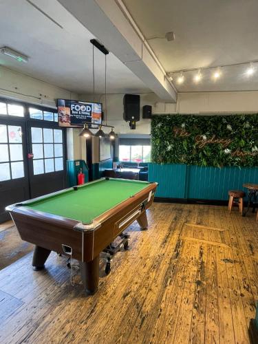 a billiard room with a pool table in it at The Sydney Arms in Dorchester