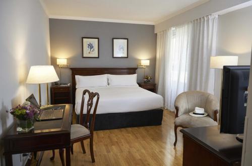 Giường trong phòng chung tại Cyan Américas Towers Hotel