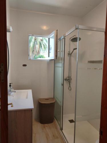 a bathroom with a shower and a sink at Villa Coral in Chiclana de la Frontera