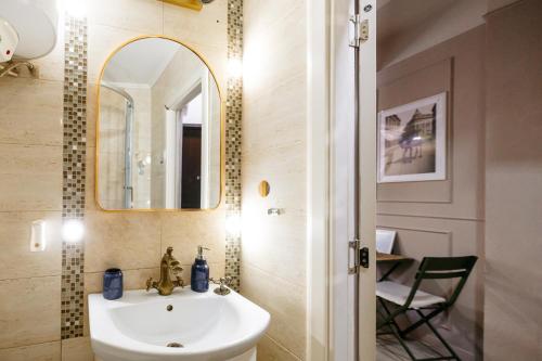 a bathroom with a sink and a mirror at Blue Camel in Old Town in Bucharest