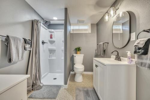 a bathroom with a toilet and a sink and a shower at The Boji Anchor off East Lake in Arnolds Park