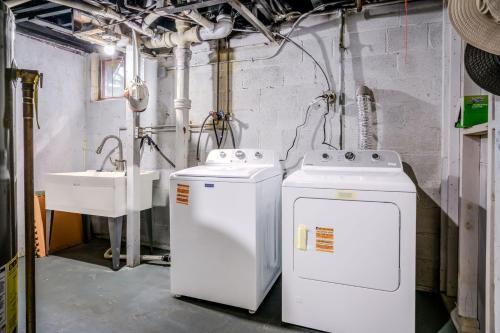 two washers and a sink in a room with pipes at Mineola Bay Lakeview and Access - Fully Furnished Monthly & Seasonal Rental in Fox Lake in Fox Lake