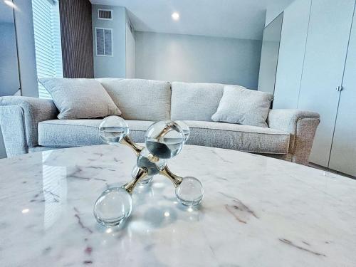 a pair of glasses on a table in a living room at Cloud Nine Studio in Des Moines