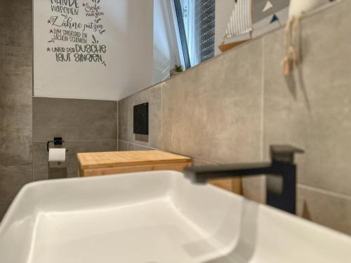 a kitchen with a white sink in a room at Wolfring in Fensterbach
