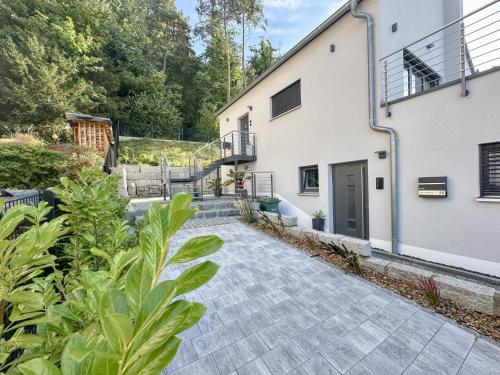 a walkway in front of a white building at Wolfring in Fensterbach