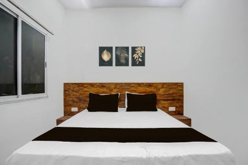 Ένα ή περισσότερα κρεβάτια σε δωμάτιο στο Super Hotel O 27 Degree Hotel
