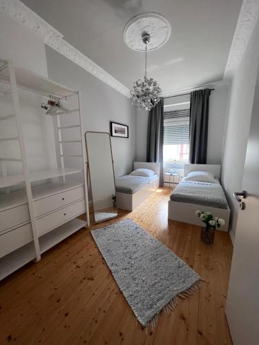 a bedroom with two bunk beds and a mirror at Business Apartment in Wiesbaden