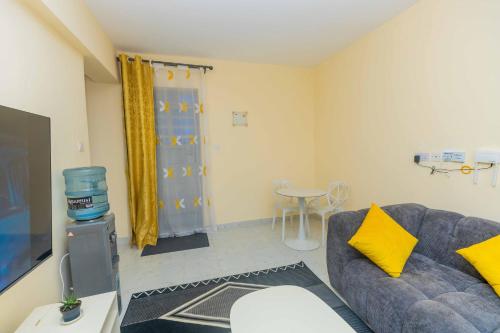 a living room with a couch and a table at Marvel Homes in Ruiru