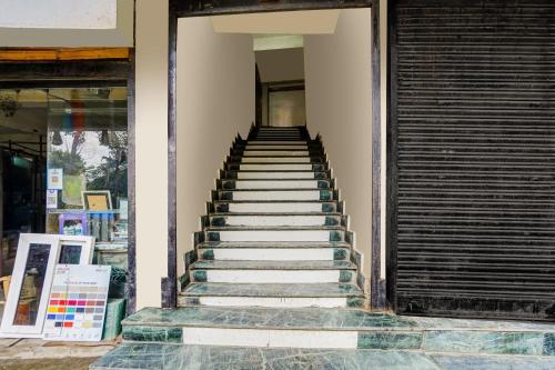 a set of stairs leading up to a building at Hotel O Yamuna Residency in Jamshedpur