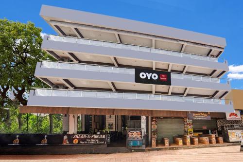 a building with an omo sign on the side of it at FabHotel Arambol Inn in Arambol