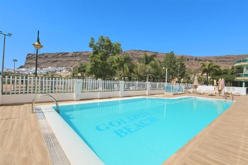a swimming pool at a condo abroad resort at GOLDEN BEACH MOGAN in Puerto de Mogán