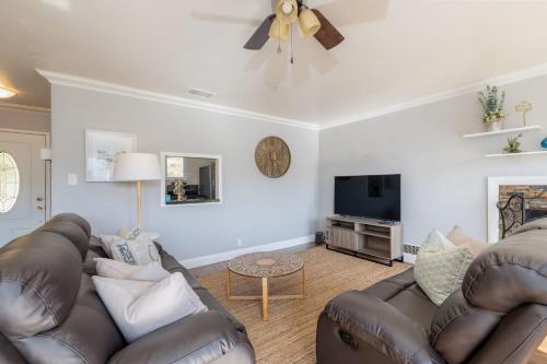a living room with a couch and a tv at Entire Ocean View Home beaches hiking restaurants family activities in Pacifica