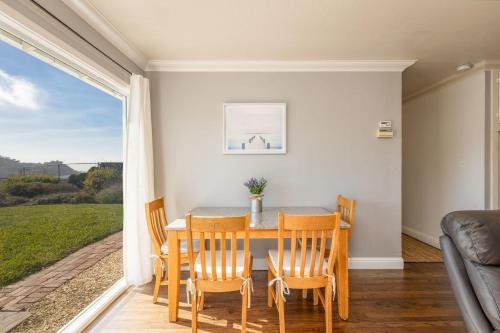 a dining room with a table and chairs at Entire Ocean View Home beaches hiking restaurants family activities in Pacifica