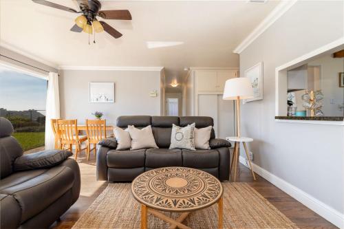 a living room with a couch and a table at Entire Ocean View Home beaches hiking restaurants family activities in Pacifica