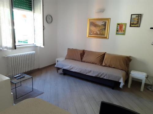a living room with a couch and a table at A&V Apartment in Santa Margherita Ligure